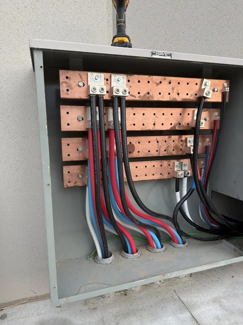 Open electrical distribution panel with organized feeder cables
