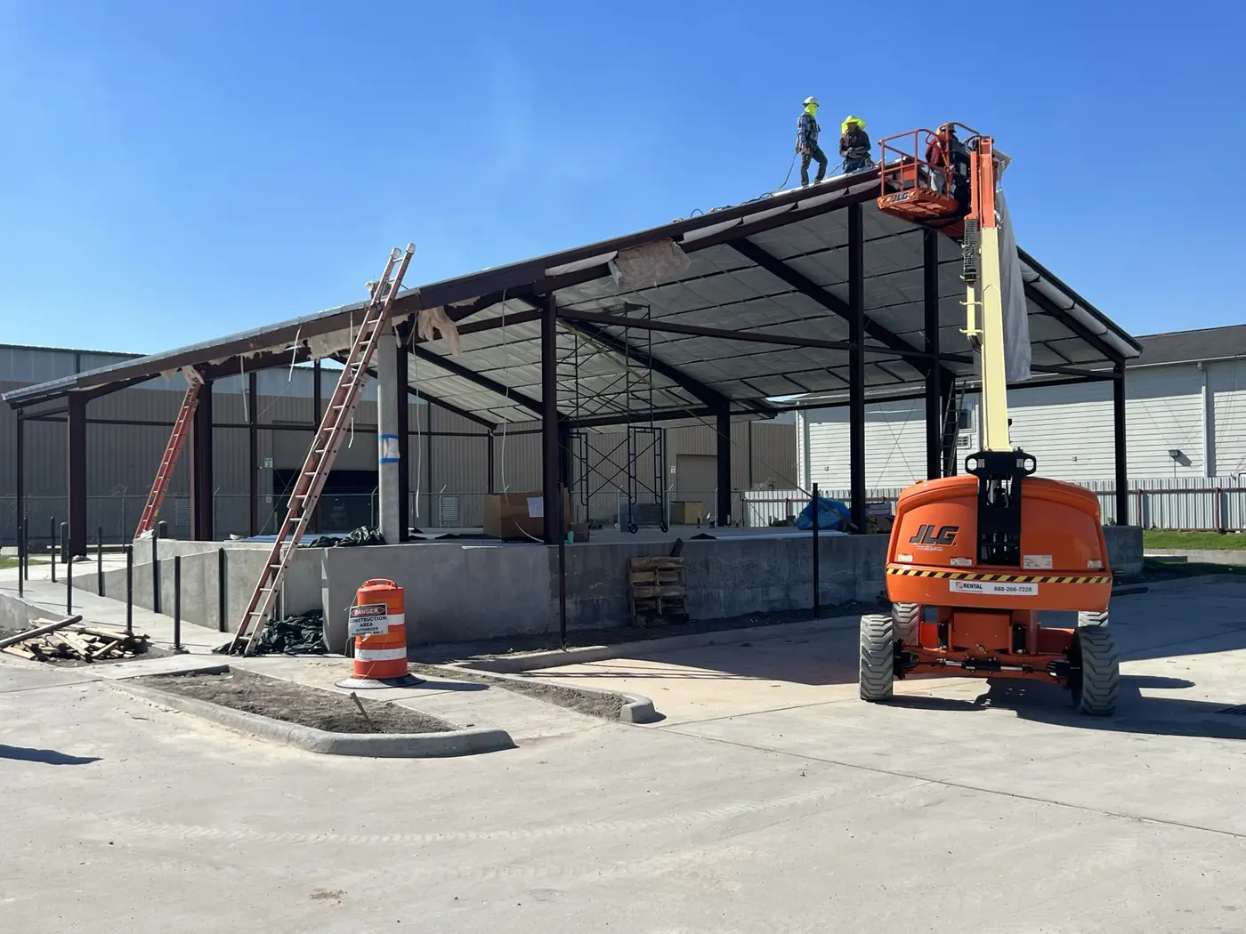 Crew working from a lift during commercial steel-frame erection