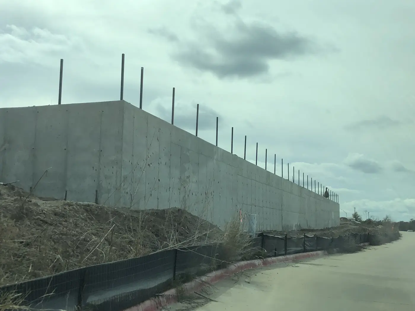 Tilt-wall concrete panels installed alongside active sitework