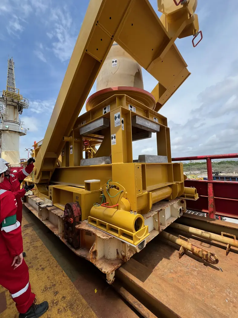 Heavy yellow lifting equipment used for industrial pipe operations