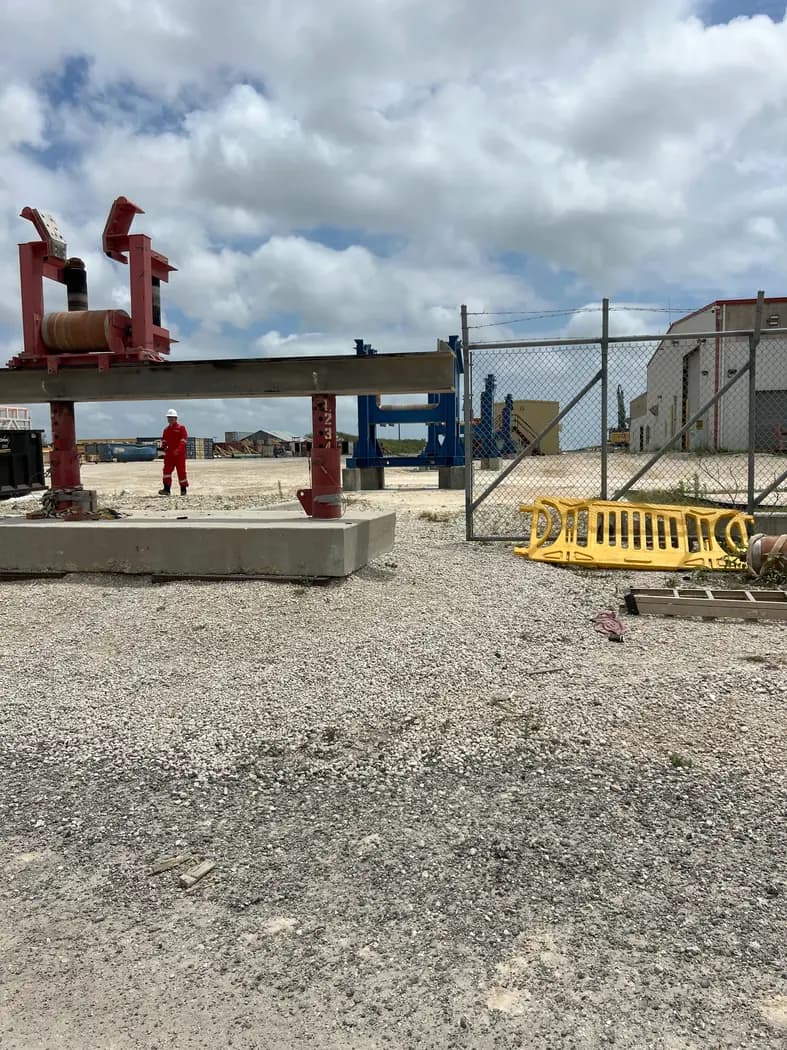 Prepared industrial work area with pipe supports and handling equipment