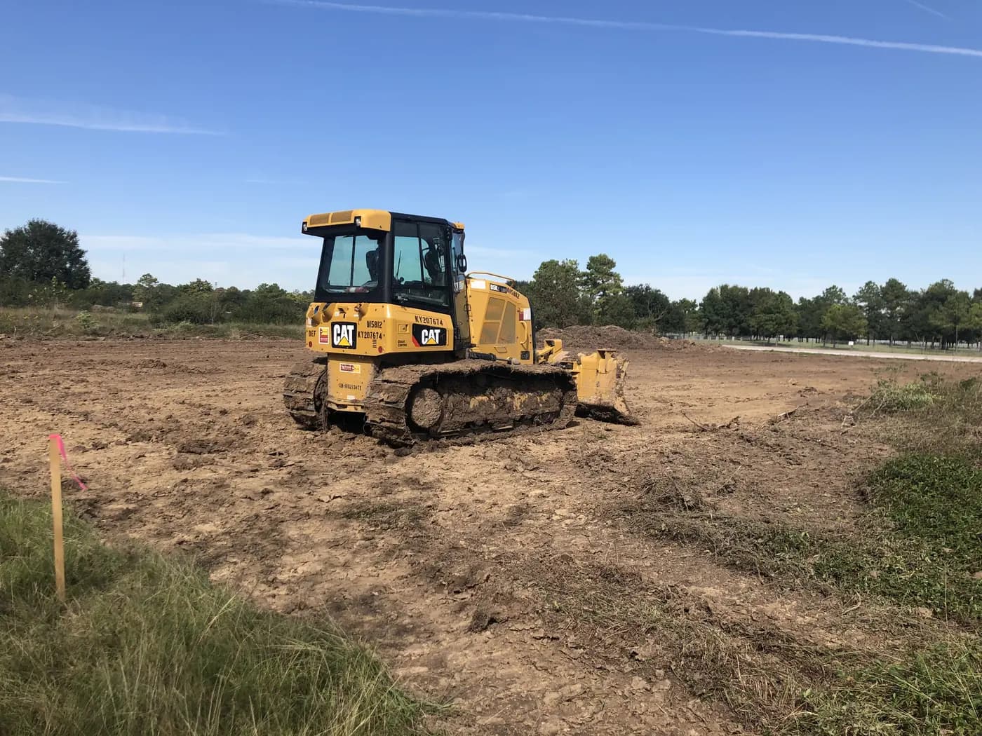 Bulldozer grading an open development site