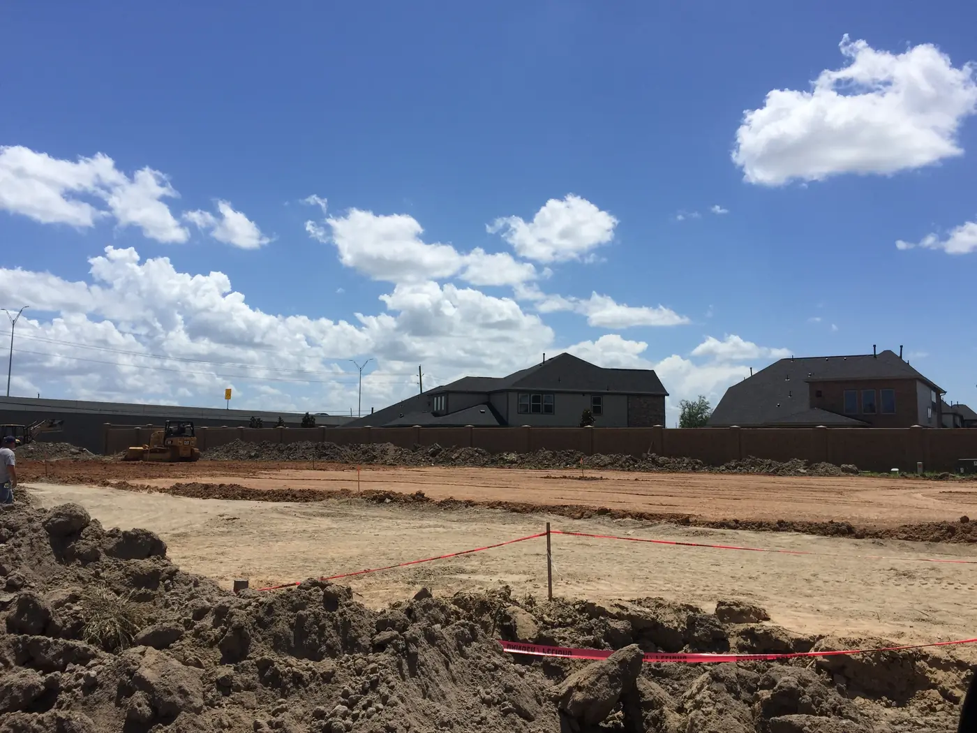Prepared site with visible underground utility work